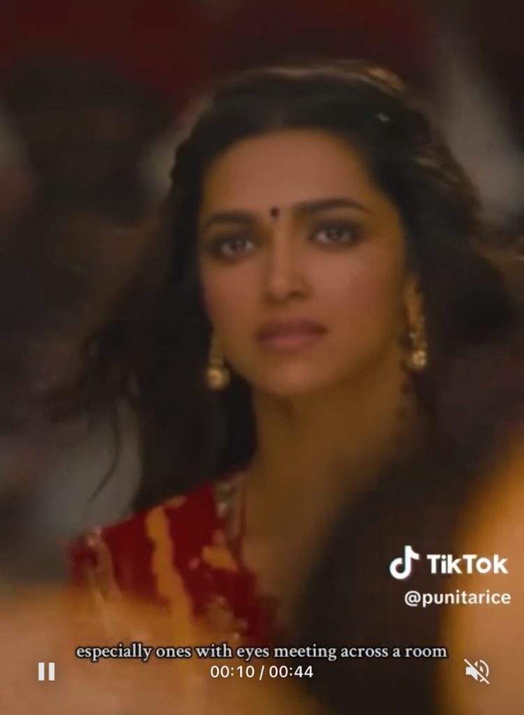 Ranveer Singh's Ram and Deepika Padukone's Leela looking at one another in "Nagada Sang Dhol" (from Ram-Leela).